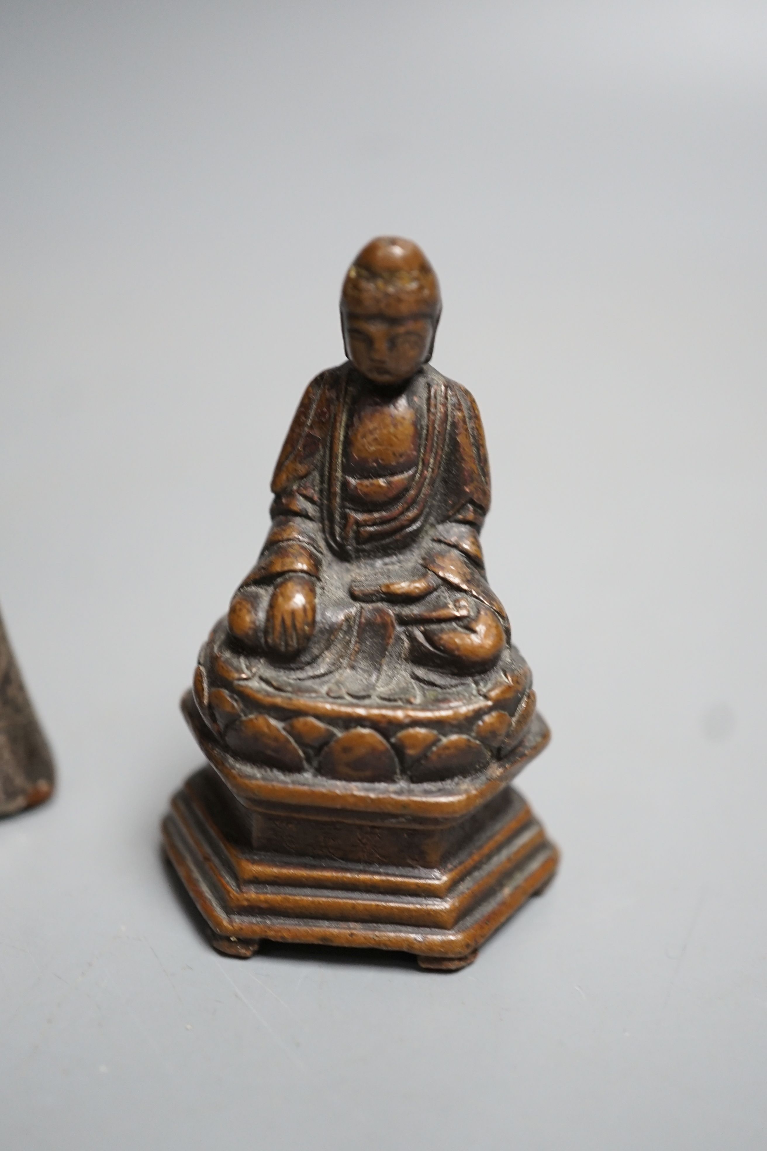 A small 19th century bronze figure of Buddha seated and a Burmese silver overlaid wood figure of Buddha, largest 7.5cm